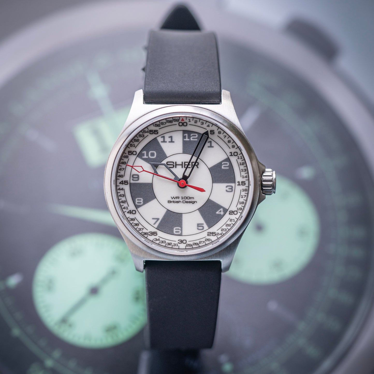 Watch with a black strap on a blurred background